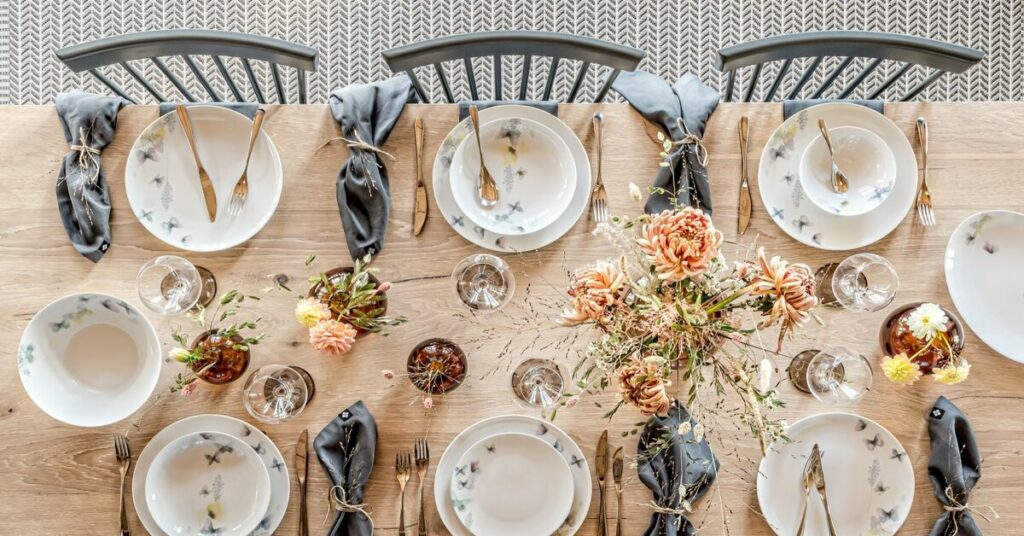 a table with plates and silverware