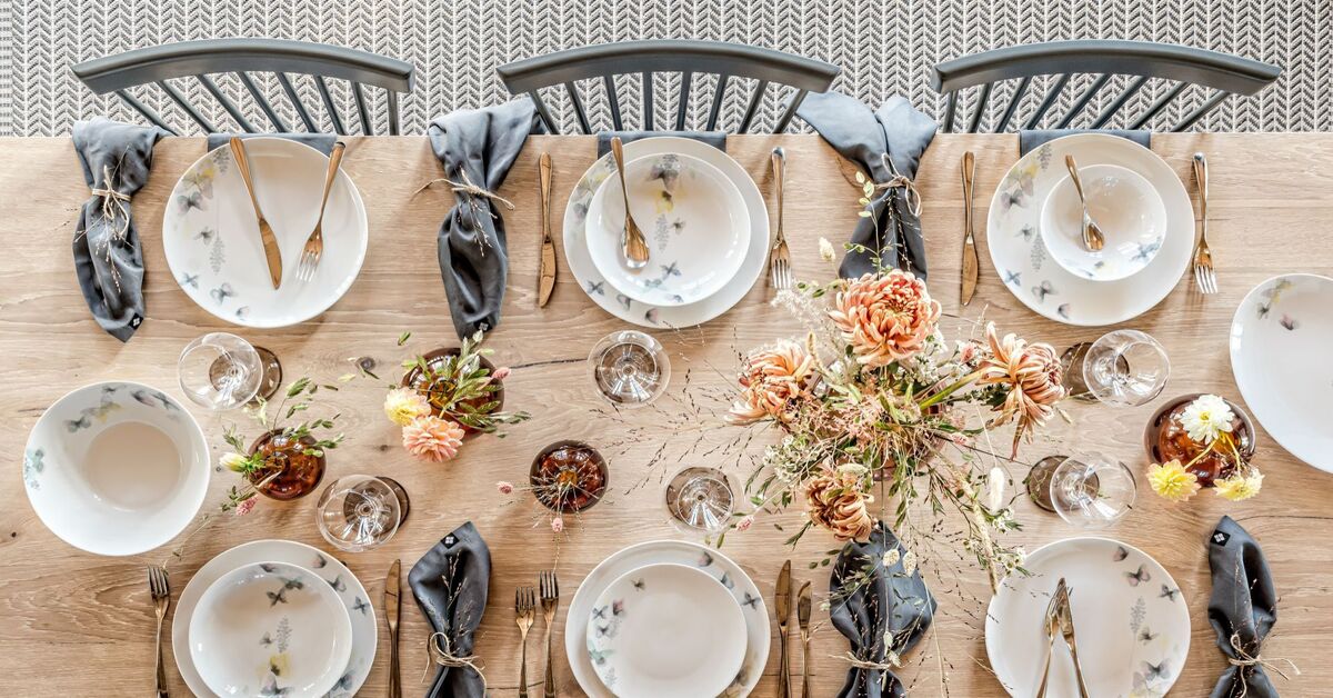 a table with plates and silverware